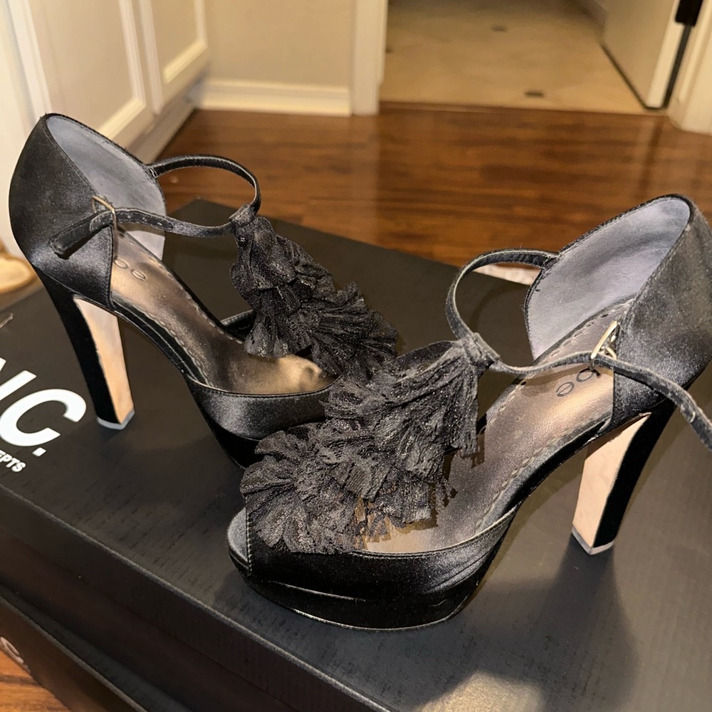 Bebe ruffle black heels
